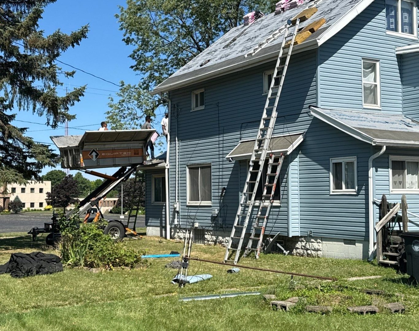 Diamond Roofing Pros using roofing tools