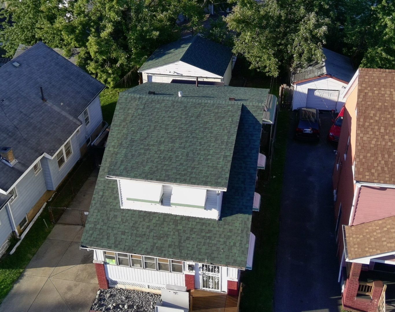 Detailed roof inspection in Stow OH assessing shingle and gutter damage