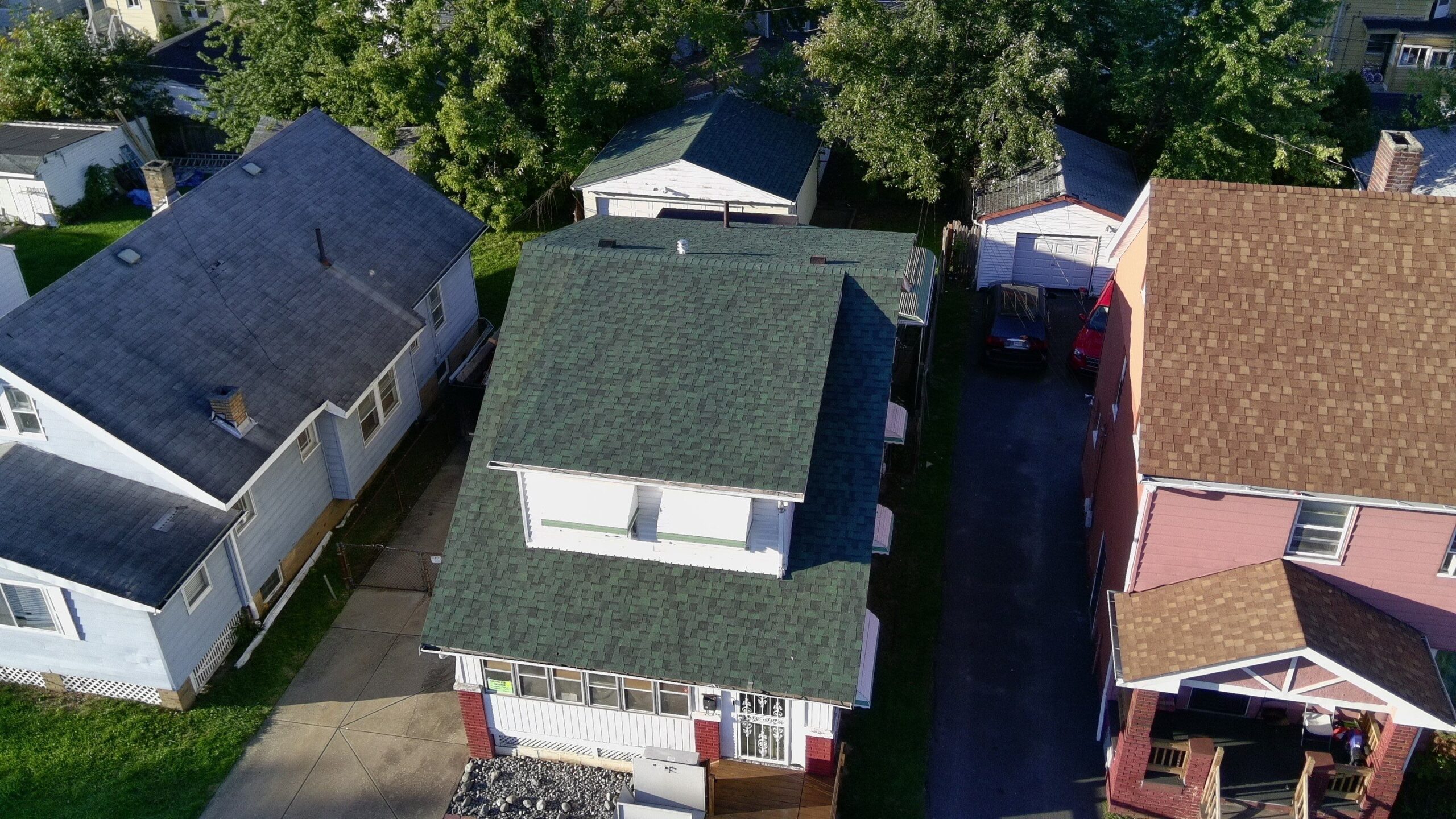 Detailed roof inspection in Stow OH assessing shingle and gutter damage